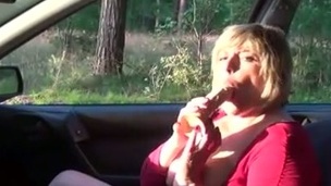 Fantastic short haired older blond slut was blowing cock in the car